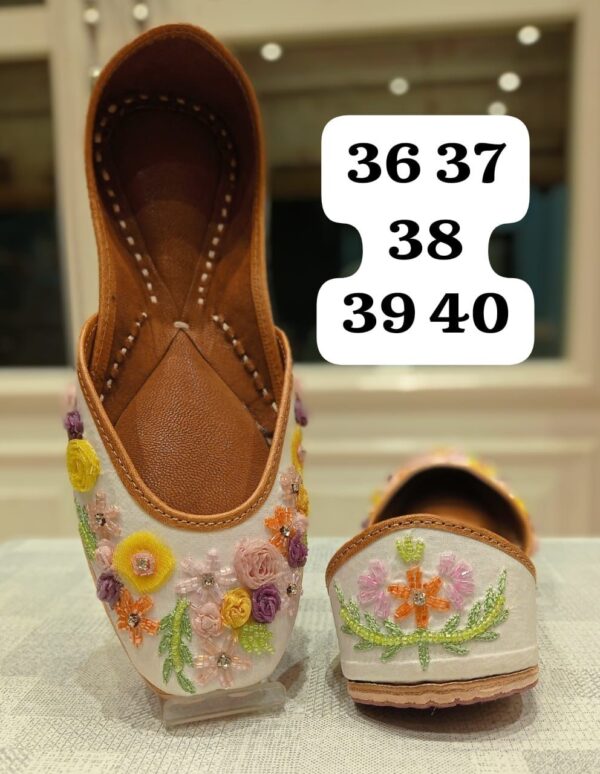 Traditional White Jutti with Vibrant Floral Embroidery – Perfect for Festive & Casual Wear